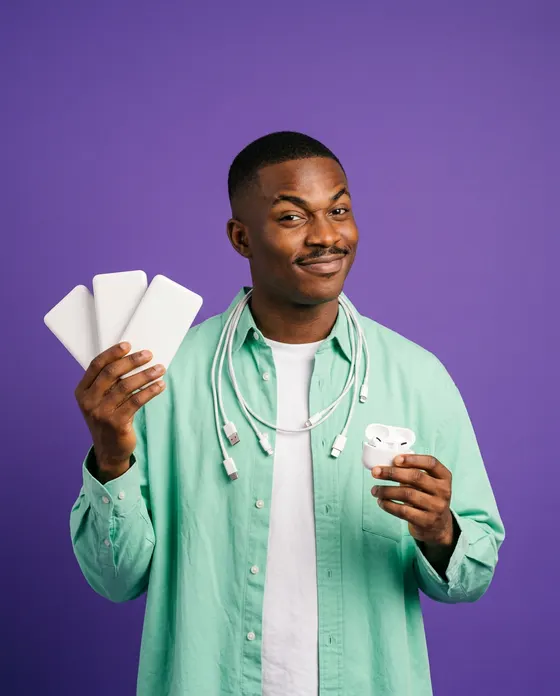 Emeka, an AI-generated character, holding power banks and earbuds